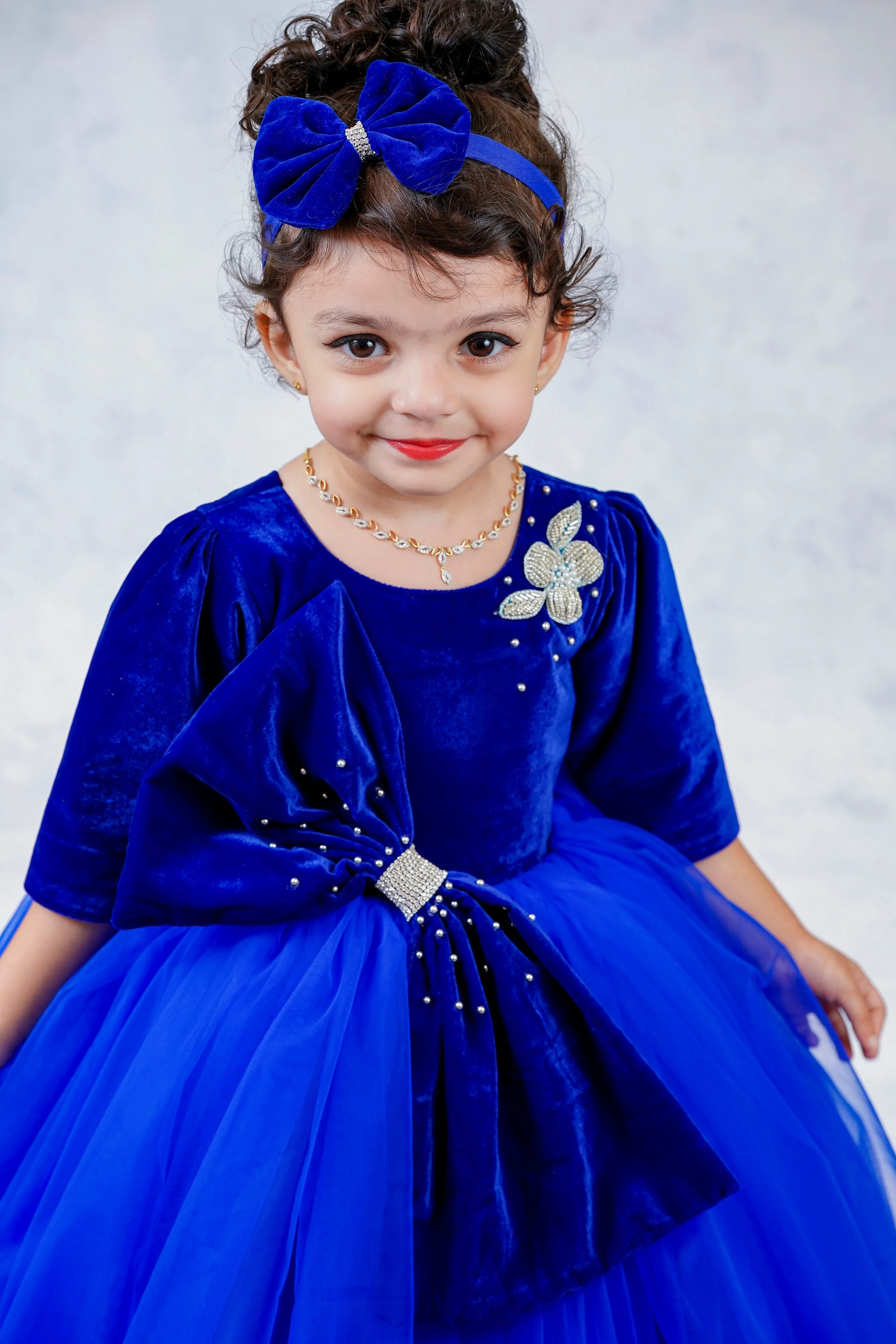 Pre-Order:  Royal Blue Velvet Partywear Gown With Designer Bow Detailing