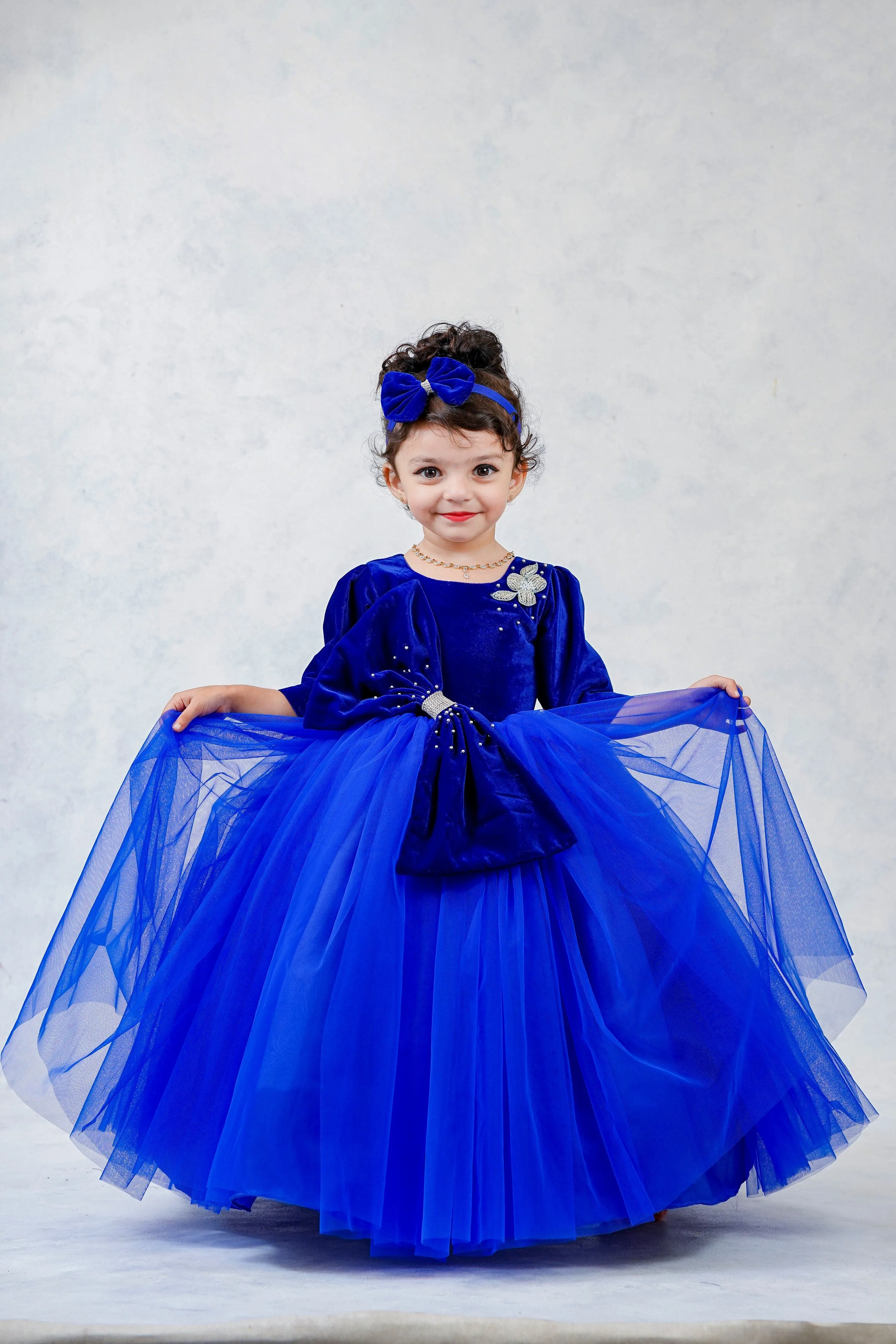 Pre-Order:  Royal Blue Velvet Partywear Gown With Designer Bow Detailing